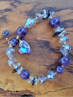 Sparkly amethyst bracelet with mixed crystal accents and a delicate charm detail